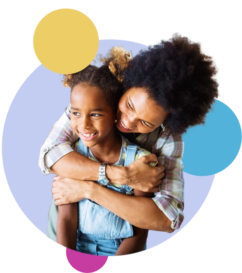 A mother embracing her daughter while they both smile